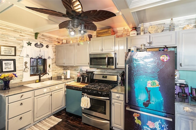 kitchen featuring white cabinets, sink, ceiling fan, dark hardwood / wood-style flooring, and stainless steel appliances