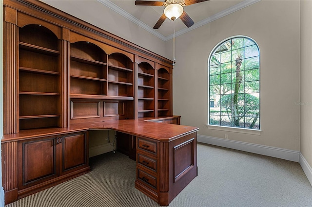 carpeted office featuring ceiling fan and crown molding