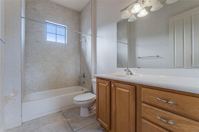 full bathroom with tile patterned floors, toilet, vanity, and tiled shower / bath