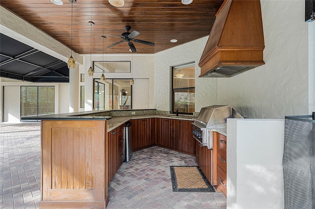 view of patio / terrace with an outdoor kitchen, ceiling fan, an outdoor wet bar, and a grill