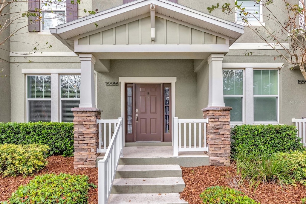 property entrance featuring covered porch