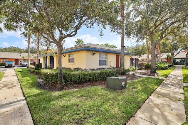 ranch-style house with a front lawn