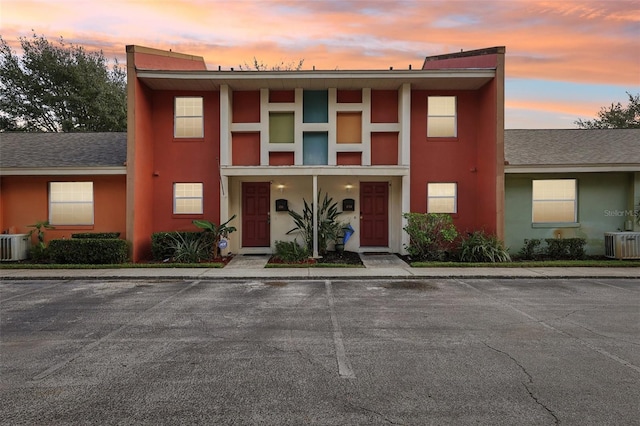 view of front facade featuring central AC