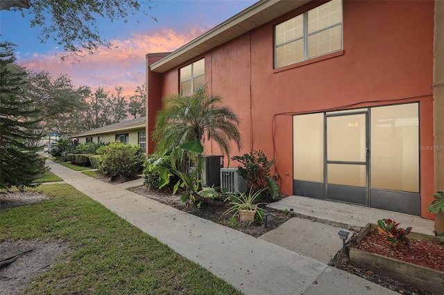 view of property exterior at dusk