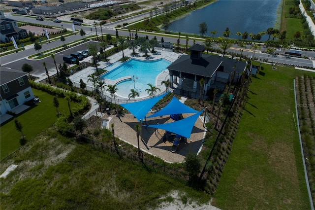 birds eye view of property with a water view