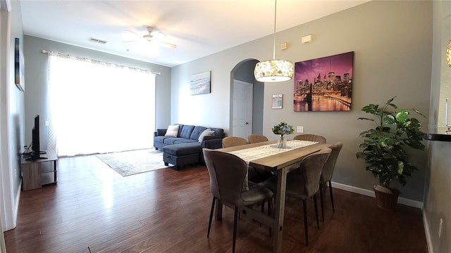 dining area featuring dark hardwood / wood-style floors and ceiling fan