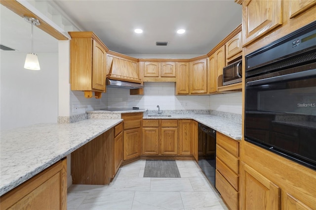 kitchen featuring sink, light stone counters, decorative light fixtures, decorative backsplash, and black appliances