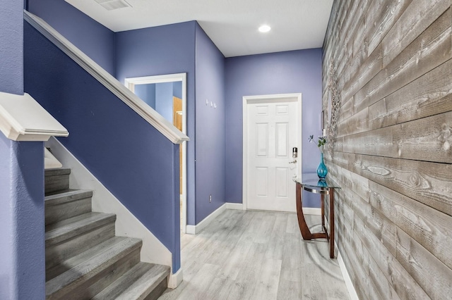 foyer entrance with wood-type flooring