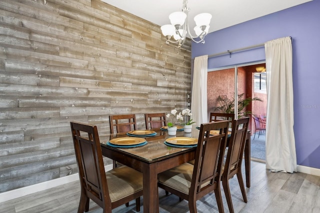 dining room featuring light hardwood / wood-style flooring and a chandelier