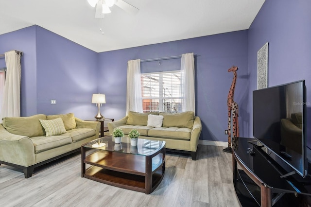 living room featuring ceiling fan and wood-type flooring