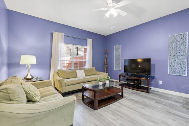 living room featuring ceiling fan and light wood-type flooring