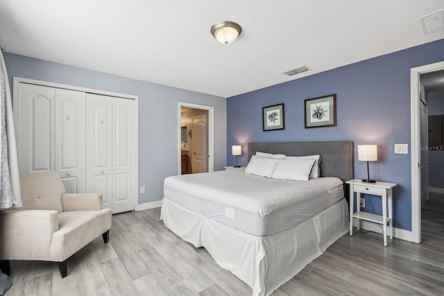 bedroom featuring a closet and hardwood / wood-style flooring