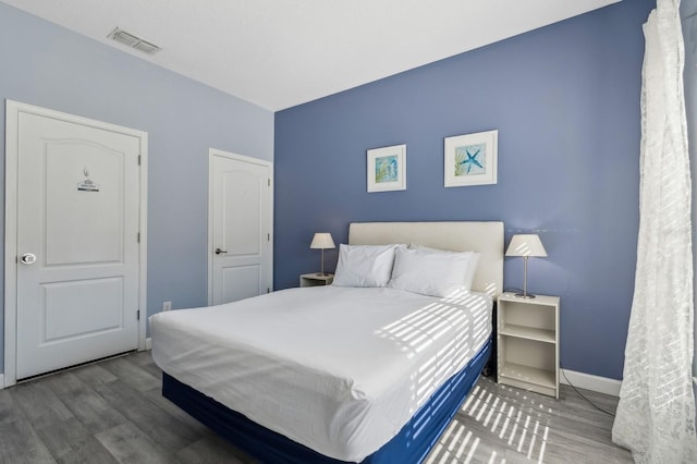 bedroom featuring wood-type flooring