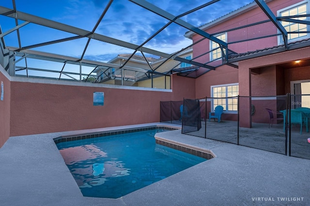 view of pool featuring a patio area and a lanai