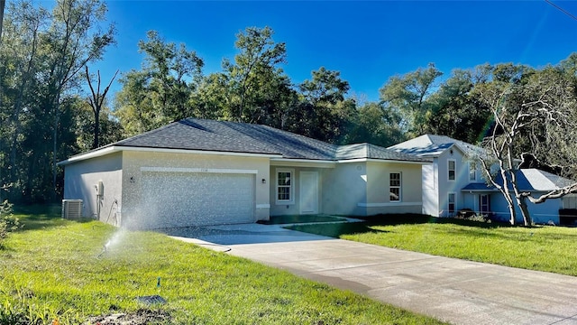 single story home featuring a garage, a front yard, and central AC