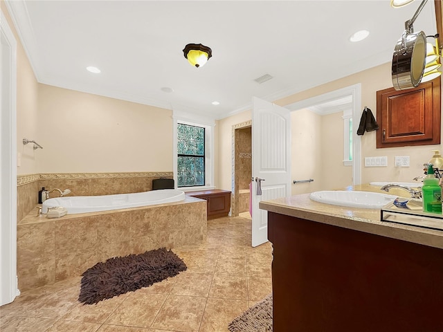 bathroom with tile patterned floors, vanity, ornamental molding, and tiled tub