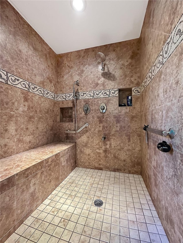 bathroom with a tile shower