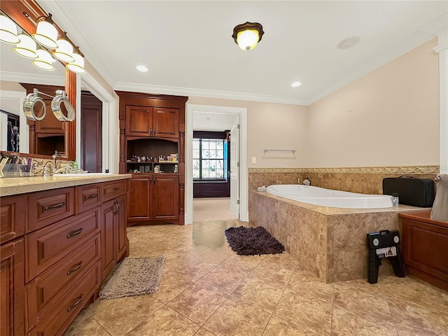 bathroom with tiled bath, vanity, and ornamental molding