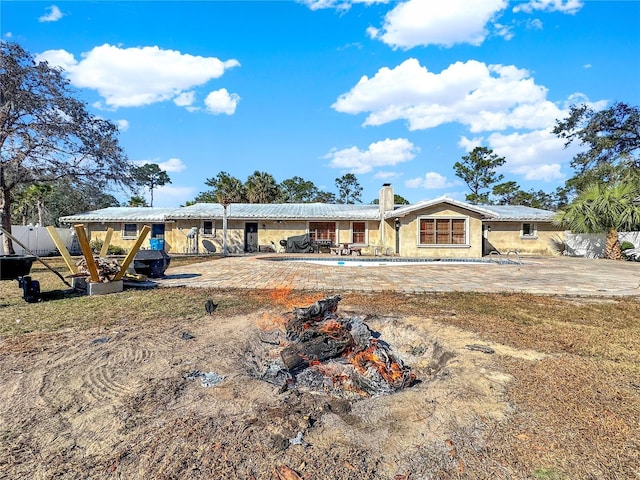 rear view of property with a patio