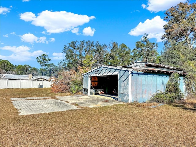 view of outdoor structure with a lawn