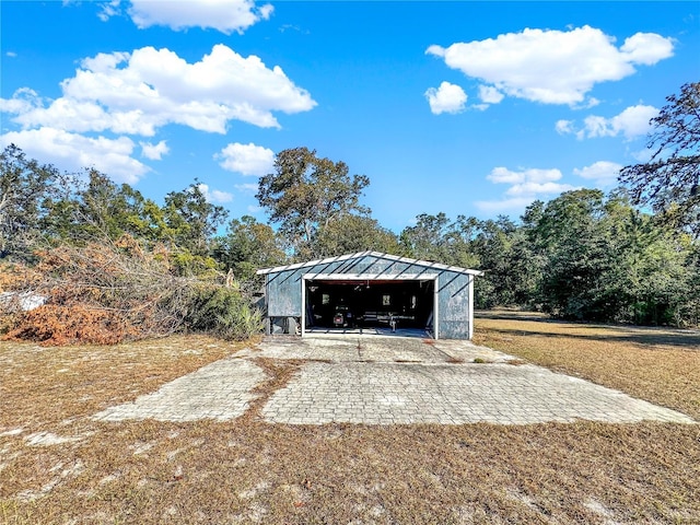 exterior space featuring an outbuilding and a garage