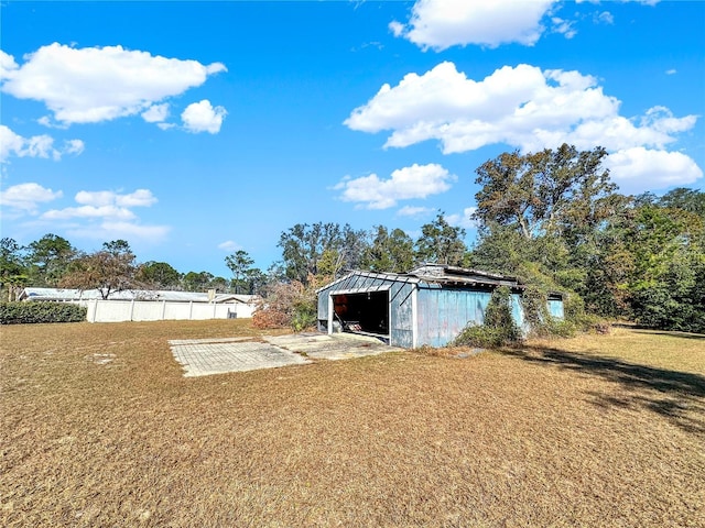 view of outdoor structure featuring a lawn