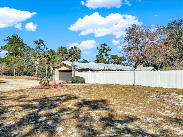 view of yard featuring a garage