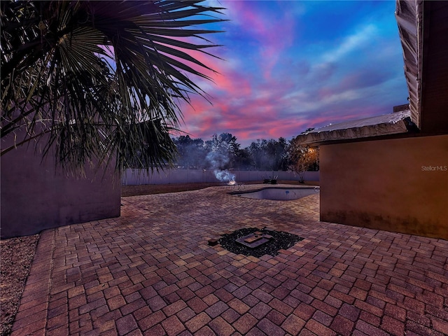 view of patio terrace at dusk