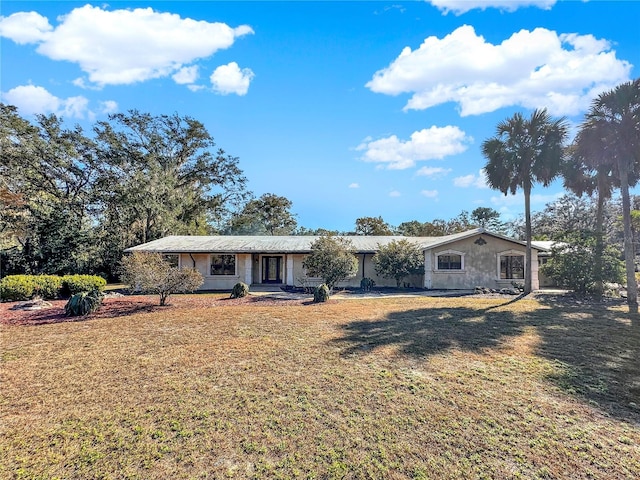 ranch-style house with a front lawn