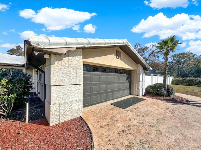 view of property exterior with a garage