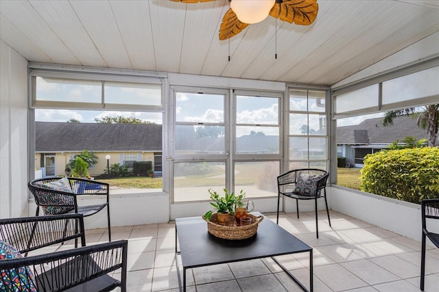 sunroom / solarium with ceiling fan and wooden ceiling