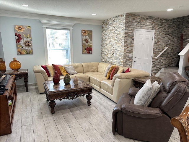 living room with light hardwood / wood-style floors and crown molding