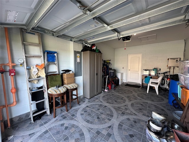 4803 Apple Blossom Ln Unit 4803, Saint Cloud, FL 34771 - garage with a garage door opener, concrete block wall, and electric panel
