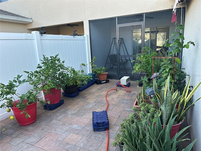 view of patio with a sunroom