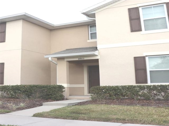 4803 Apple Blossom Ln Unit 4803, Saint Cloud, FL 34771 - view of front facade with stucco siding