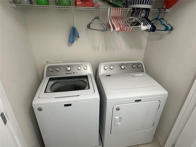 laundry room featuring separate washer and dryer