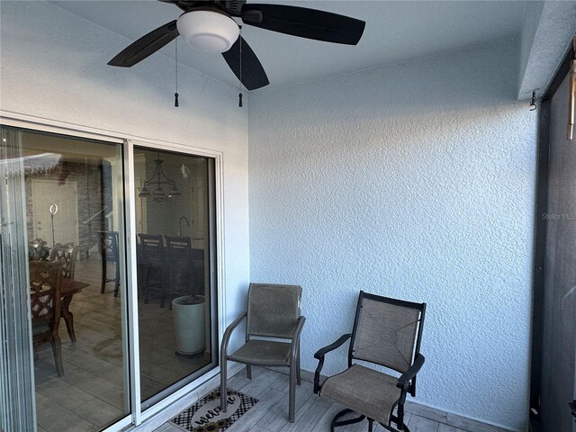 exterior space with ceiling fan