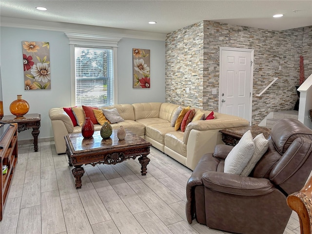 living room with light hardwood / wood-style floors and ornamental molding