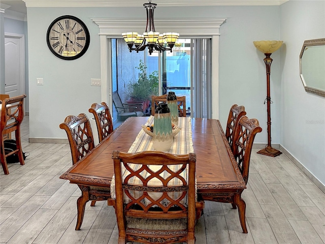 4803 Apple Blossom Ln Unit 4803, Saint Cloud, FL 34771 - dining room with a chandelier, crown molding, light wood-style flooring, and baseboards