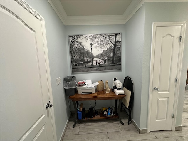 interior space with light hardwood / wood-style flooring and ornamental molding