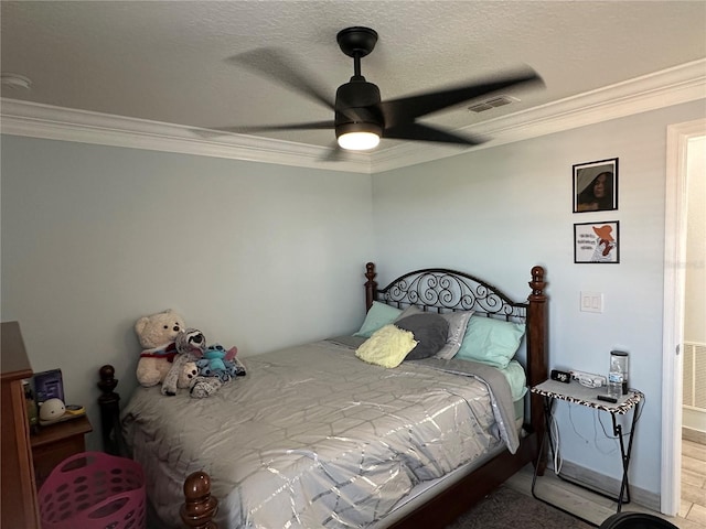 bedroom with ceiling fan and crown molding