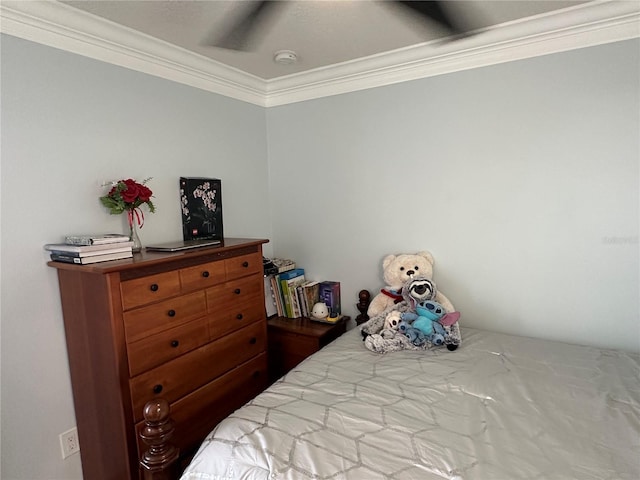 bedroom with ceiling fan and ornamental molding