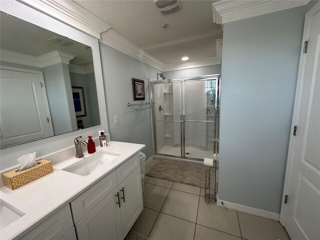 4803 Apple Blossom Ln Unit 4803, Saint Cloud, FL 34771 - bathroom with vanity, a stall shower, baseboards, tile patterned flooring, and ornamental molding