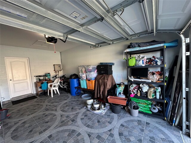 4803 Apple Blossom Ln Unit 4803, Saint Cloud, FL 34771 - garage featuring a garage door opener and concrete block wall