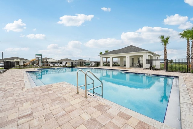 view of swimming pool with a patio