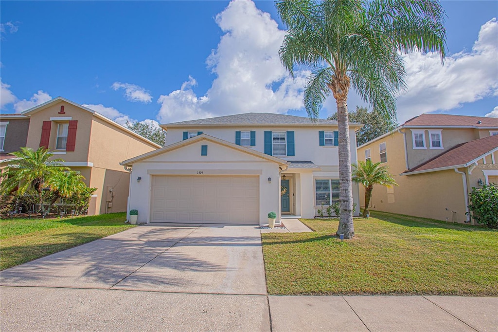 1319 Bella Coola Dr, Orlando, FL 32828 - view of front facade featuring a garage and a front yard