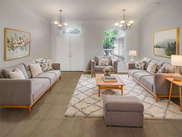 tiled living room with a notable chandelier