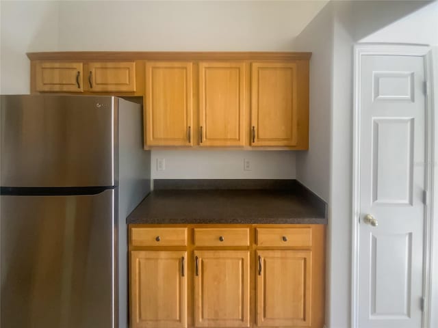 kitchen featuring stainless steel fridge