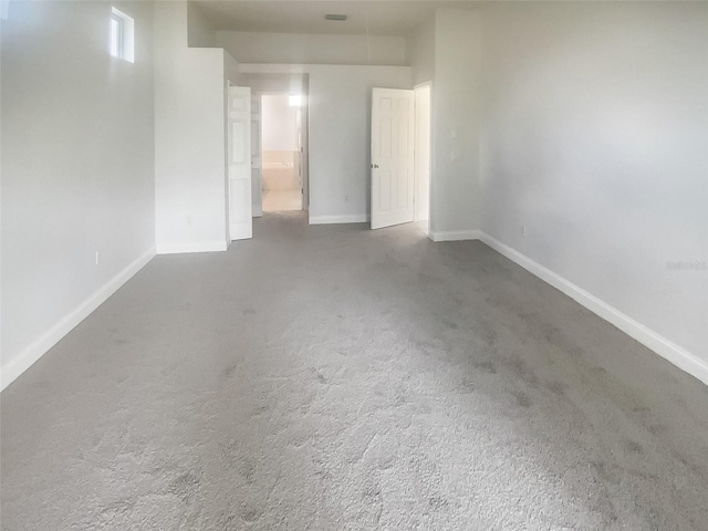 spare room featuring carpet flooring