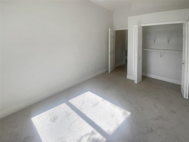 unfurnished bedroom featuring a closet and carpet